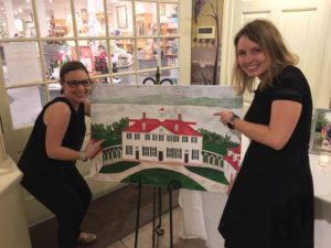 image of wedding photographers posing with mount vernon alternative guestbook painting