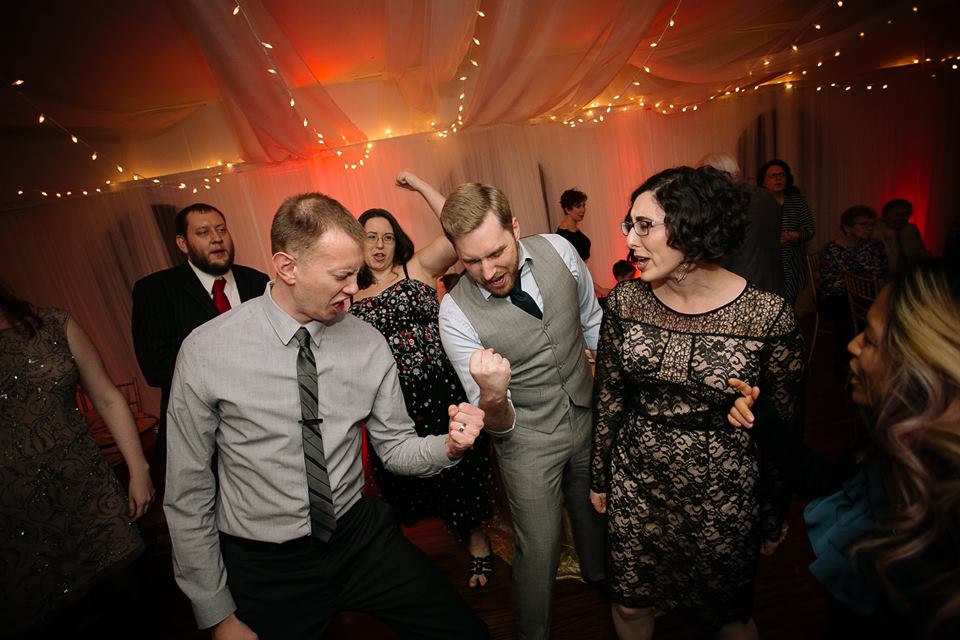 image of wedding guests dancing at reception