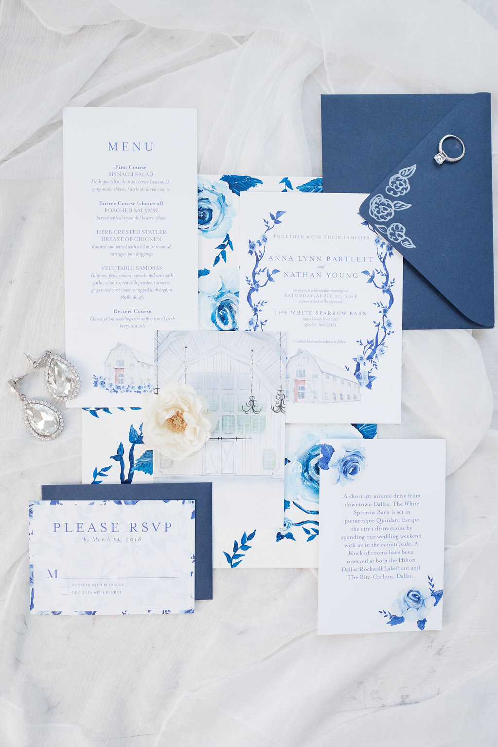 Professionally styled blue and white wedding invitation suite featuring the White Sparrow Barn in Quinlan, Texas
