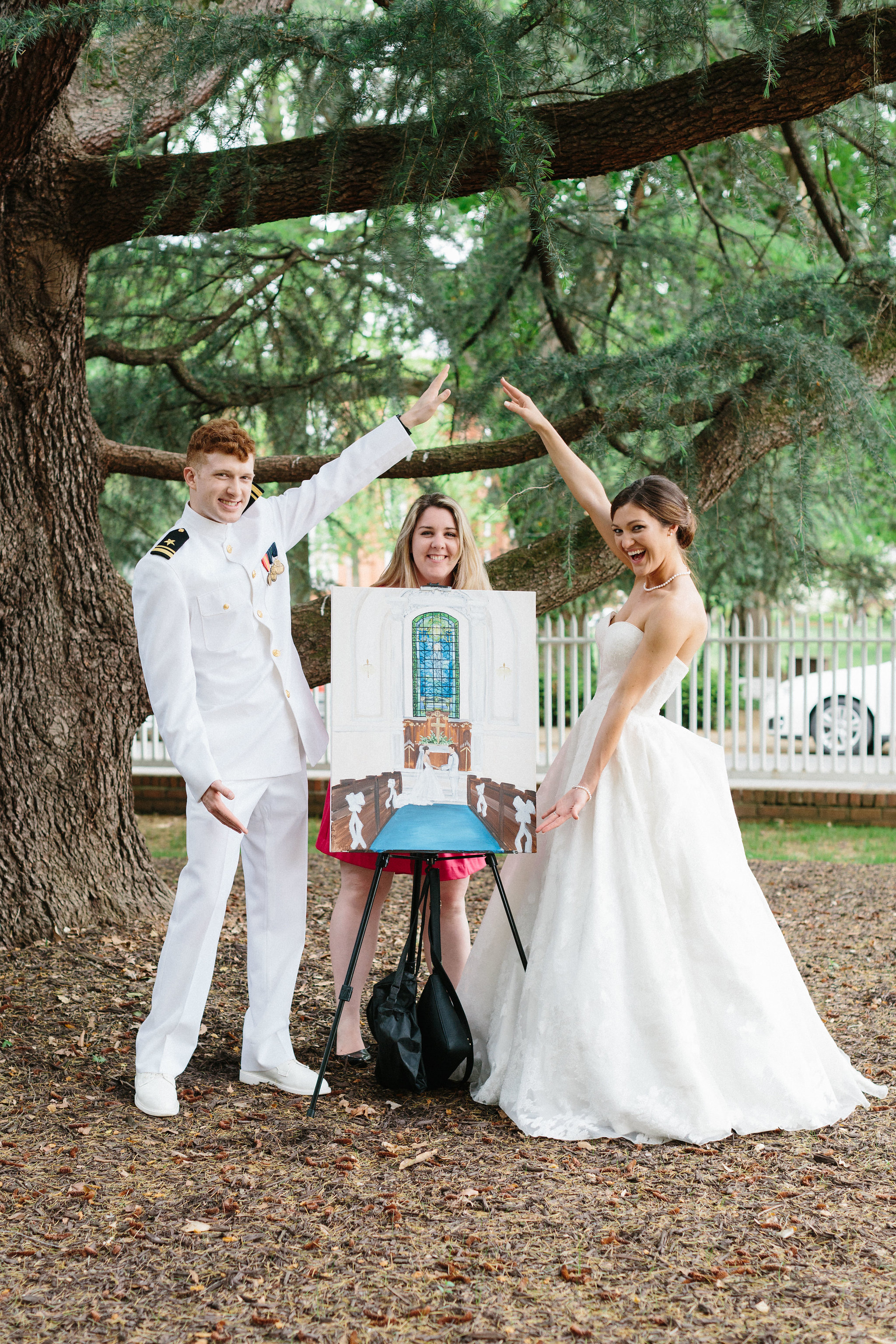 US Naval Academy bride and groom posing with live wedding painter Brittany Branson