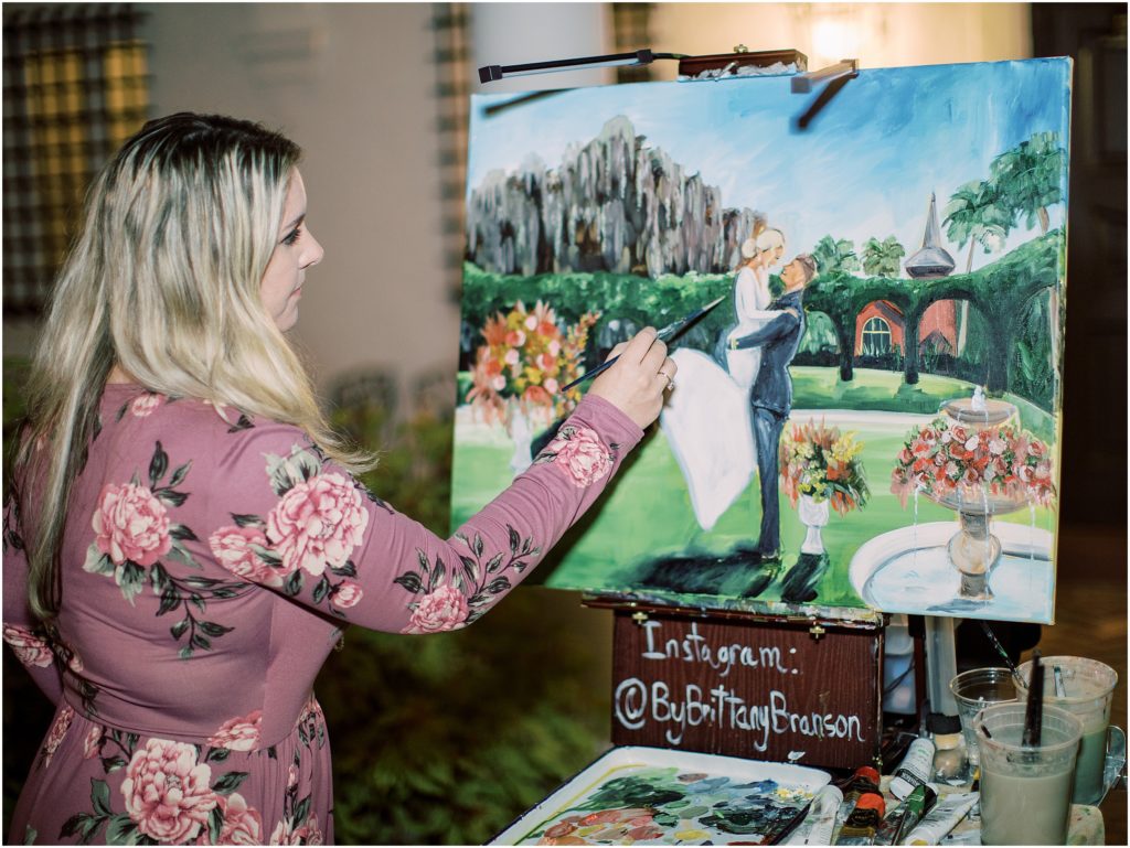 Live wedding painter Brittany Branson painting a canvas capturing a Bride and Groom's first dance at the Jekyll Island Club in Georgia.