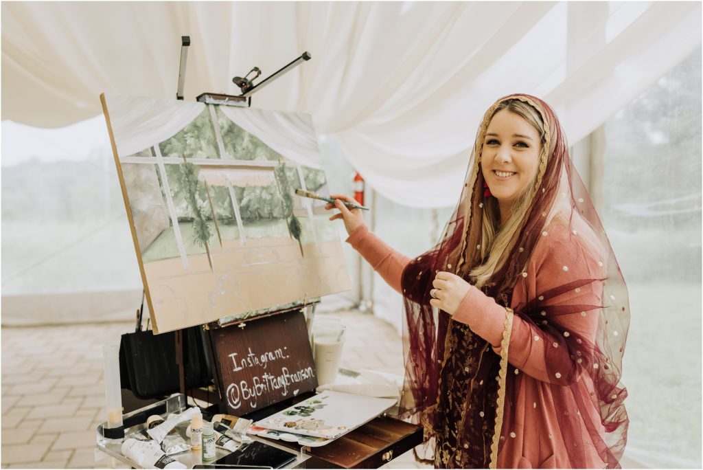 Live wedding painting Brittany Branson creates a traditional Sikh Anand Karaj live wedding painting.