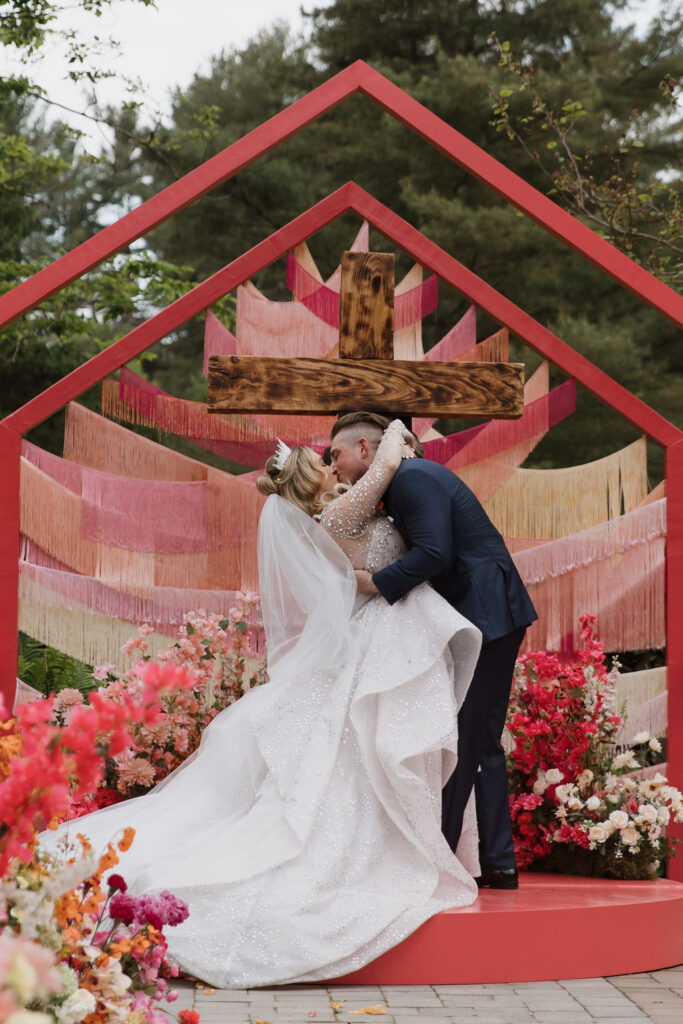 The first-kiss shot of Baylen and Colin, which is how they are depicted in Brittany's painting of their wedding.