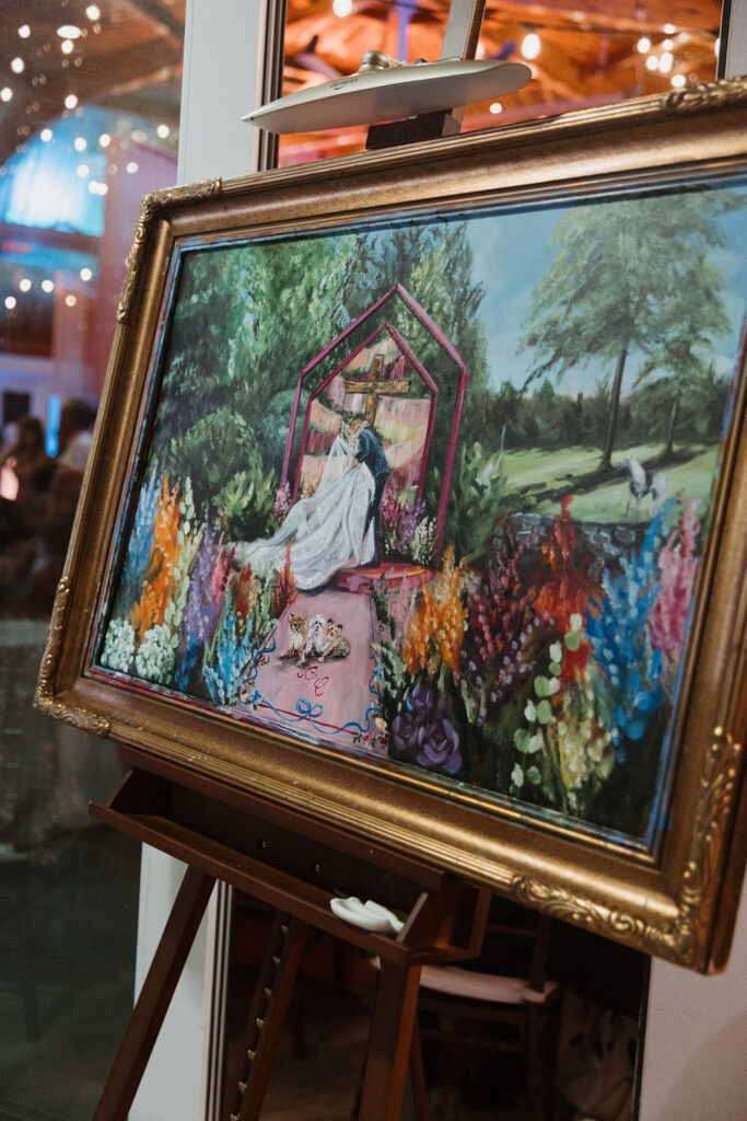 A detailed shot of the final wedding painting that highlights the white horse the Colin rode in on in the background.